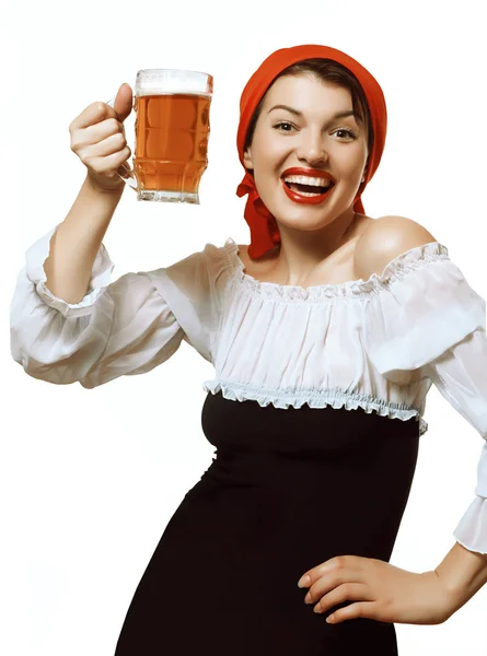 Cheerful girl with a mug of beer — ストック写真