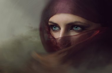 Hijab seksi mavi gözlü genç Arap kadın. Tonlama