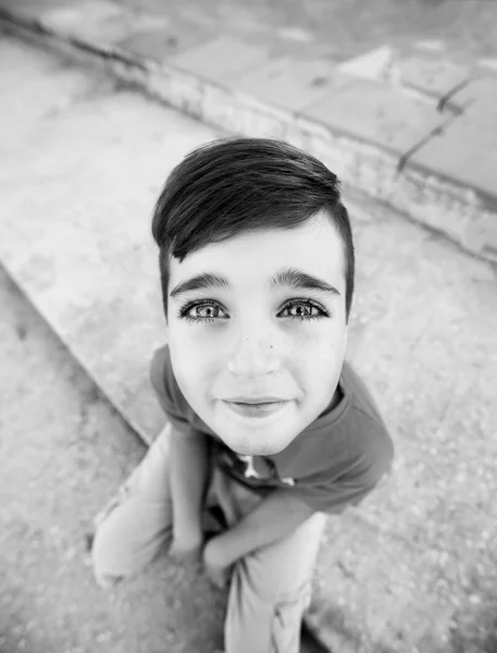 A portrait of a  boy with a funny face and big head — Stock Photo, Image