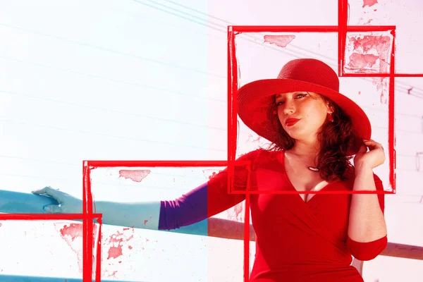 Portrait of fashion woman in red dress and hat on the bridge — Stock Photo, Image