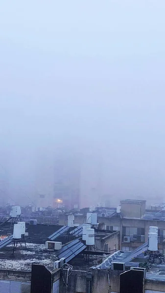 View from roof of building. Fog over the city. High quality 4k footage