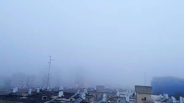 View from roof of building. Fog over the city. High quality 4k footage