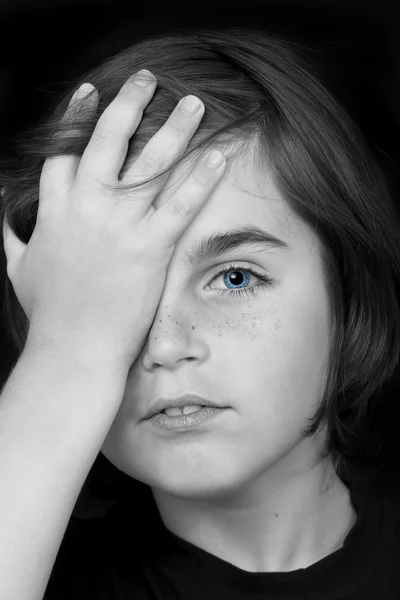 Portrait of cute little boy closed one eye with his hand. studio — Stock Photo, Image