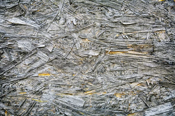 Fragment de vieux copeaux de bois pressés comme texture de fond — Photo