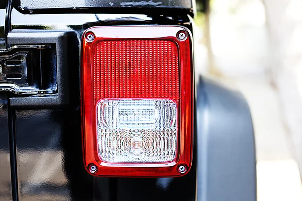 Close-up view of black sports car rear light. — Stock Photo, Image