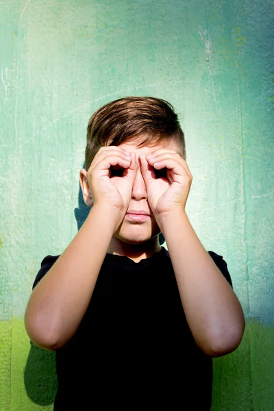 Boy using hands like glasses — Stock Photo, Image