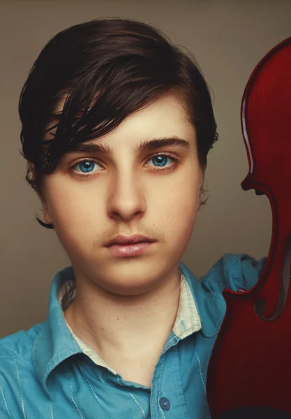 Beautiful boy holding a violin — Stock Photo, Image