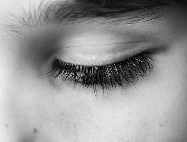 Closed human eye close up studio shot. Child eye. — Stock Photo, Image
