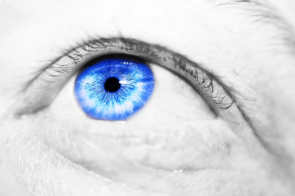 Image of man 's blue eye close up . — стоковое фото