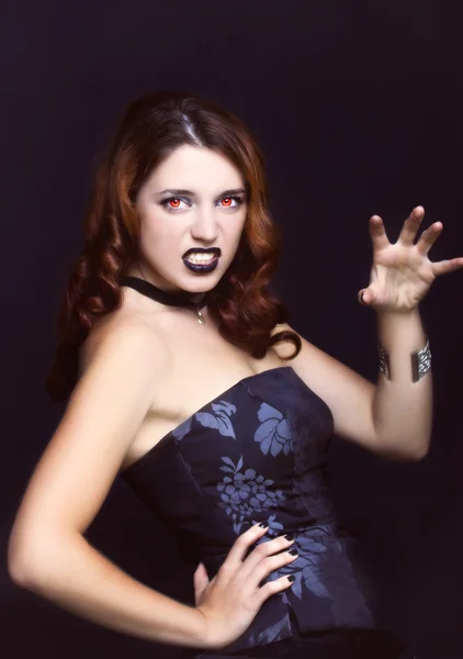 Evil vampire girl portrait on black background — Stock Photo, Image