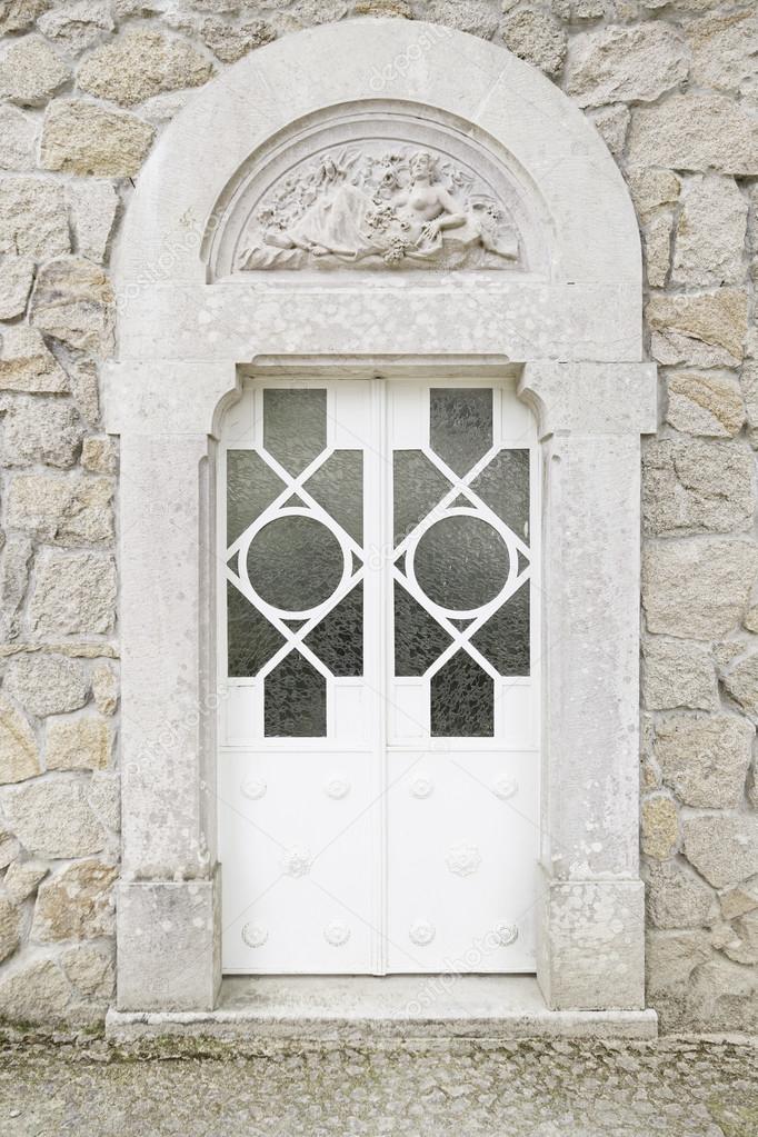 Old closed white door