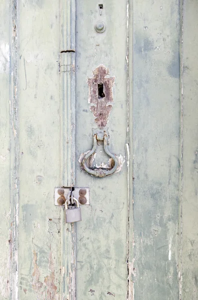 Closed wooden door with decoration — Stock Photo, Image