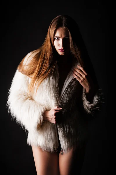 Sexy woman in white fur coat — Stock Photo, Image