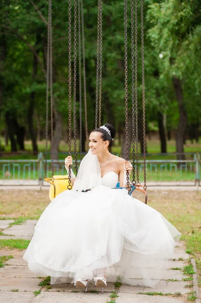 Smiling  Bride on swing — Stock Photo, Image