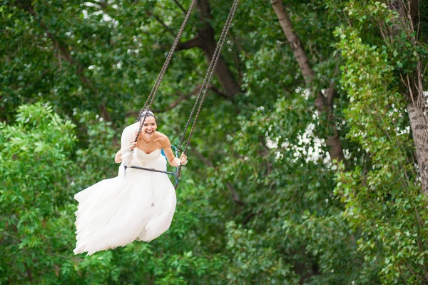 Smiling  Bride on swing — Stock Photo, Image