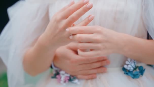 The bride twists her ring on a finger — Stock Video