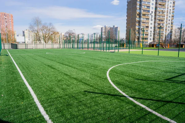 A large football field with artificial grass. — Stock Photo, Image