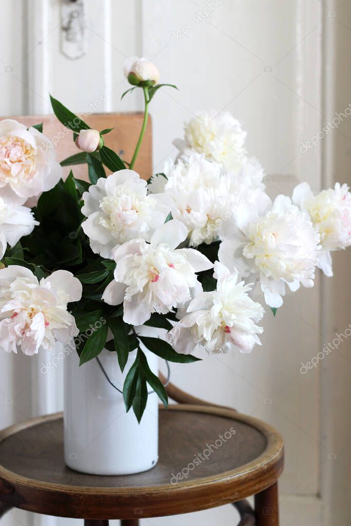 Bouquet of White and Pale Pink Peonies in Minimal White Interior Design. 