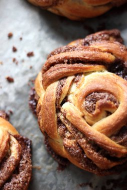 Bakery. Cinnamon Buns on Baking Tray. Breakfast Buttery Pastry.