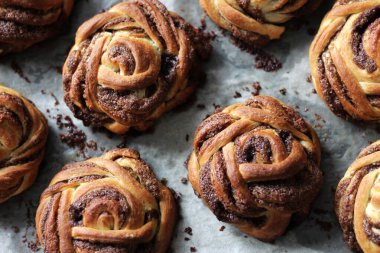 Freshly Baked Cinnamon Buns on Baking Tray. Just Baked Pastry.