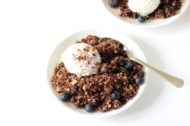 Granola Dessert with Ice Cream and Blueberries. Cooking Dessert at Home.