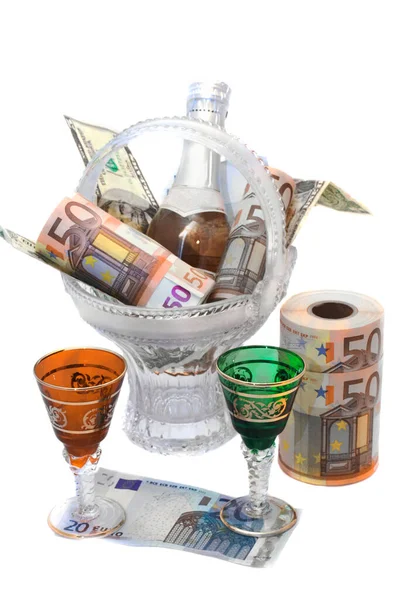 Banknotes rolled up in a roll, the bottle of wine — Stock Photo, Image