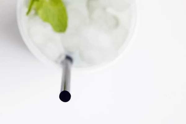 Close-up view of black straw in glass of cold drink — Stock Photo, Image