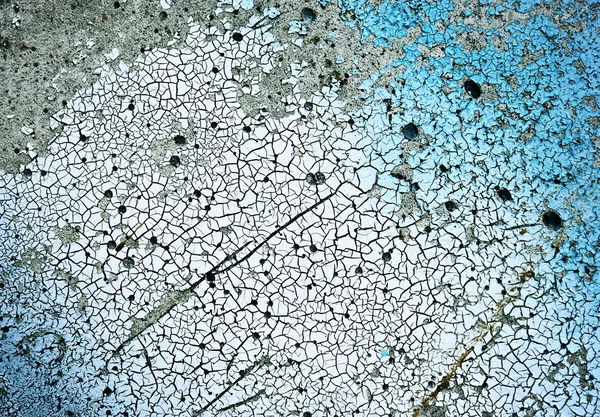 Gammal blå och vit målade ytan sprucken betong — Stockfoto