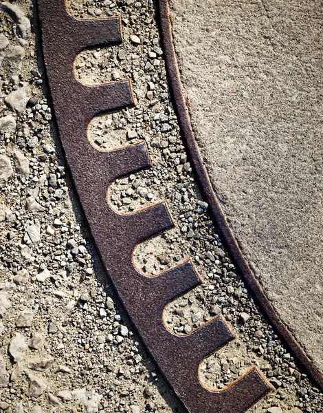 Detail rusty iron round concreted — Stock Photo, Image