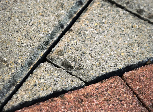 Bestrating sawed detail in elkaar grijpende — Stockfoto