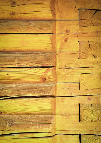 Yellow wall of wooden beams — Stock Photo, Image