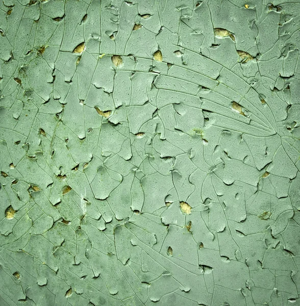 Een barst in groene verf — Stockfoto