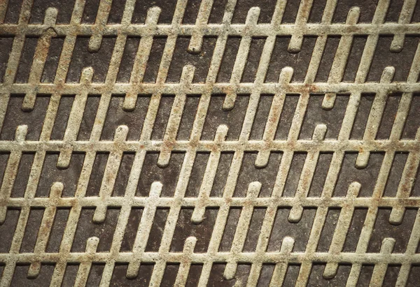 Rostiger eiserner Deckel mit Muster — Stockfoto