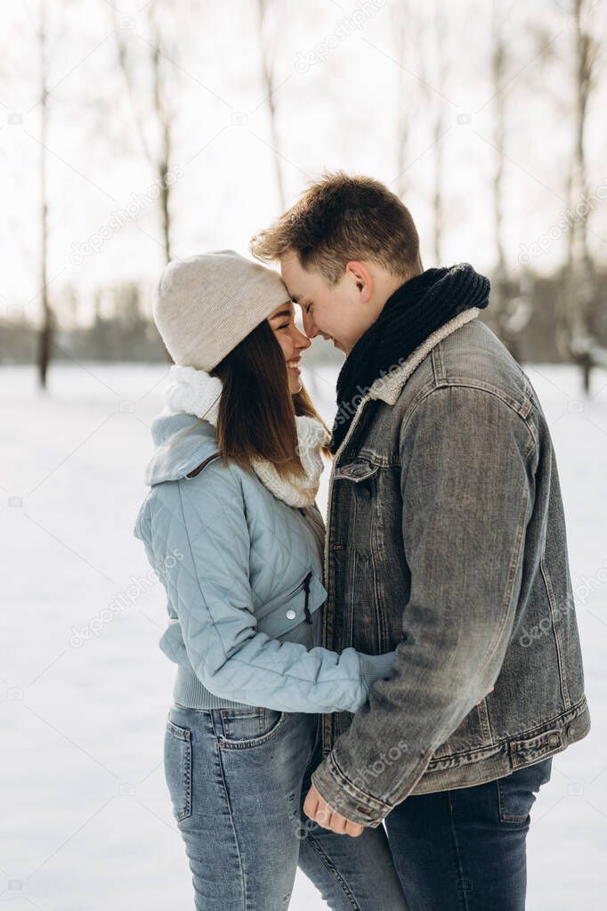 A couple walks in the winter. Couple in love. Snow. Winter.