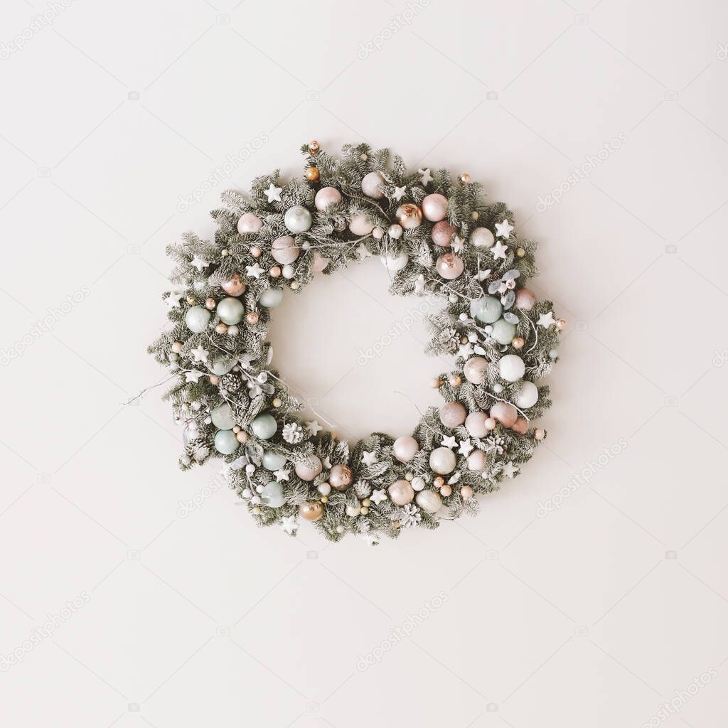 Wreath of spruce on white background. Christmas decorations. New Year holiday composition. Frame wreath mock up. Copy space 