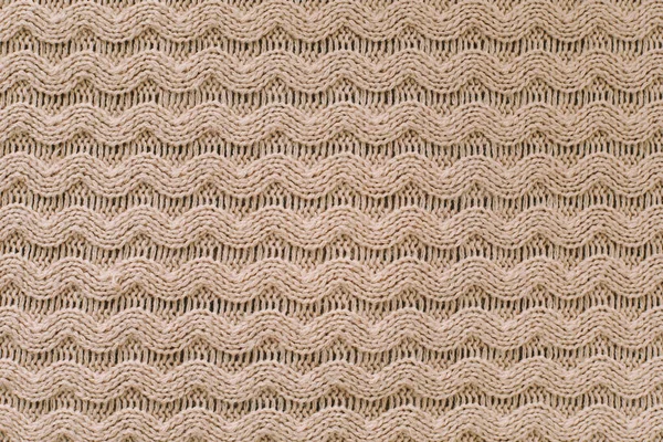 Knitted texture background. Knitting pattern of wool. Knitting. Texture of woolen fabric for wallpaper and abstract background. — Stock Photo, Image