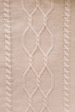 Örülmüş doku arka planı. Yün örgü deseni. Örgü örüyorum. Duvar kağıdı ve soyut arkaplan için yünlü kumaş dokusu.