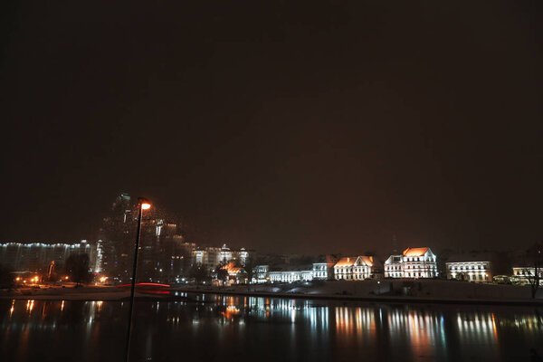 Panoramic view of Svisloch river with Trinity suburb in the evening in winter. Minsk. Belarus