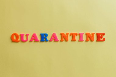 the word quarantine on a yellow background