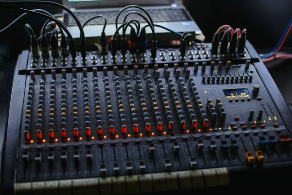 Professional audio studio sound mixer console board panel with recording , faders and adjusting knobs,TV equipment.