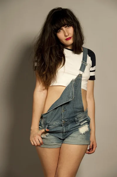 Gorgeous Young Brunette in Overalls — Stock Photo, Image