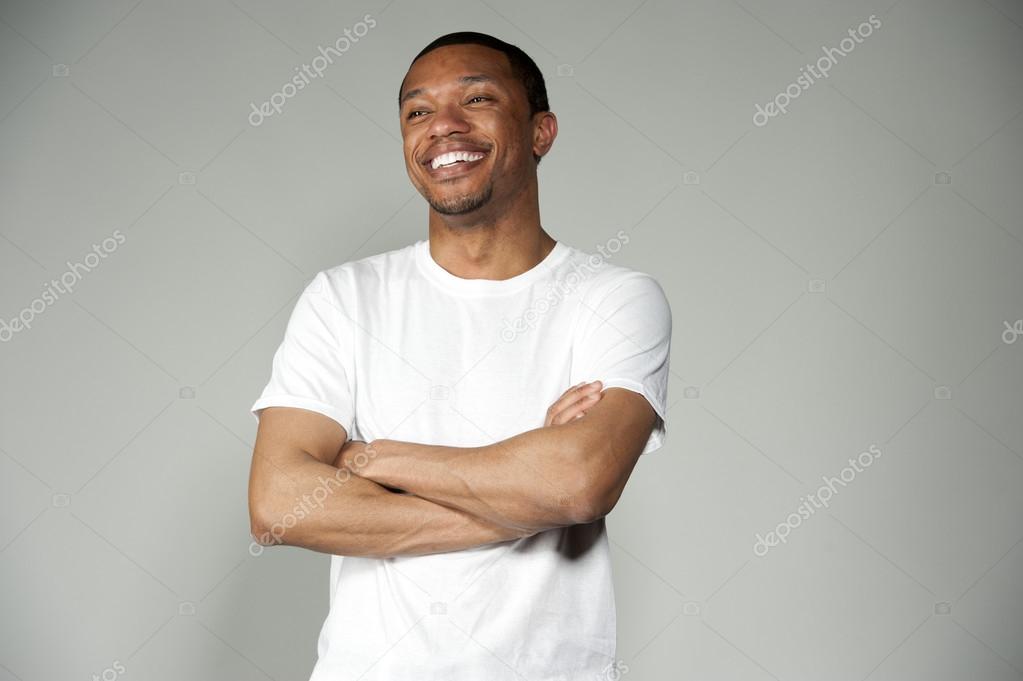 Trendy Happy and Fun Black Male Wearing A White Top