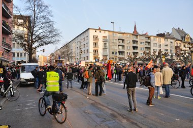 FRANKFURT, GERMANY - MARCH 18, 2015: Crowds of protesters, Demon clipart