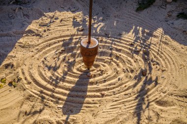 Mathematical pendulum drawing on the sand clipart