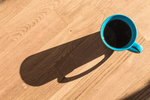 Cup of Coffee on wooden table — Stock Photo, Image