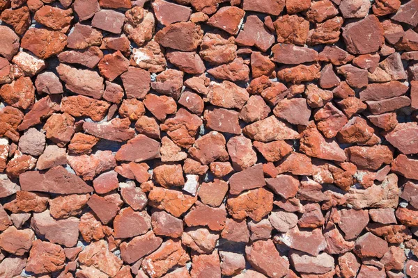 Santorini - Red pumice wall background — Stock Photo, Image