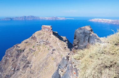 Santorini - The look from Imerovigli to the Skaros castle with the Oia and Therasia island in the background.