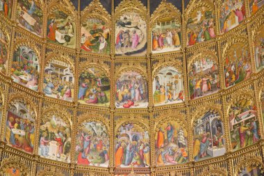 SALAMANCA, SPAIN, APRIL - 16, 2016: The detail of gothic main altar of Old Cathedral (Catedral Vieja) by Dello and Nicolas Delli (1430-1450). clipart