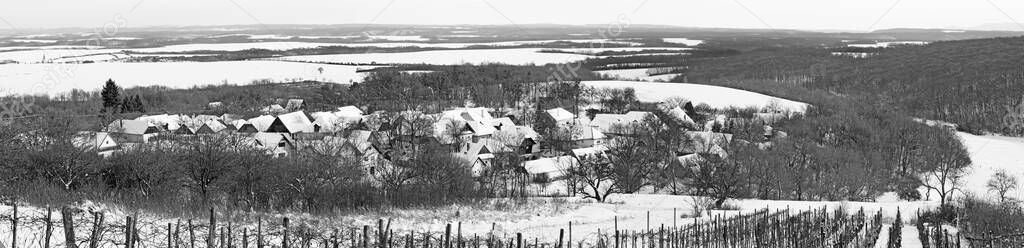 Sebechleby - The panorama settlement of old vine cellar houses from middle Slovakia (Stara Hora) in winter.