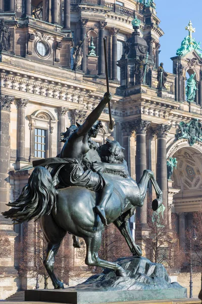 BERLIN, GERMANY, FEBRUARY - 13, 2017: The Dom and the bronze sculpture Amazone zu Pferde in front of Altes Museum by August Kiss (1842).